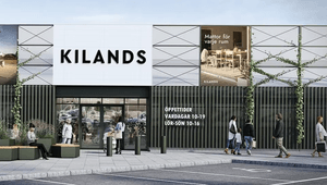 Entrén till Kilands butik med skylten 'Mattor för varje rum' och synliga öppettider på fasaden.