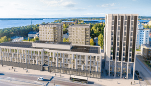 3D-visualisering i fågelperspektiv av moderna bostads- och kontorshus vid en väg nära en stor sjö eller havsbukt.