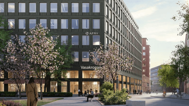 Digital rendering (3D-bild) av en modern kontorsbyggnad i mörkgrått med en fasad av små, rektangulära fönster. Logotyperna "Scandic" och "AFRY" syns på fasaden, och texten "Vasakronan" är synlig nära entrén. I förgrunden finns en trädkantad gångväg med bl