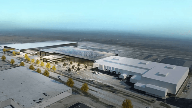 3D-rendering i högt fågelperspektiv av ett storskaligt logistik- och industrikomplex med solceller på taket och parkeringsytor under en klarblå sky